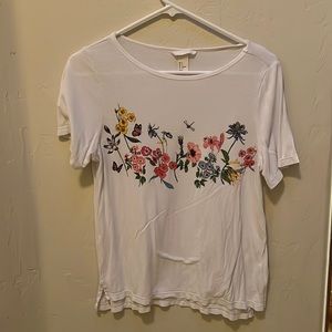 A White floral shirt that is very Flowey